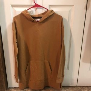 Yellow/Gold in color. Wears long.